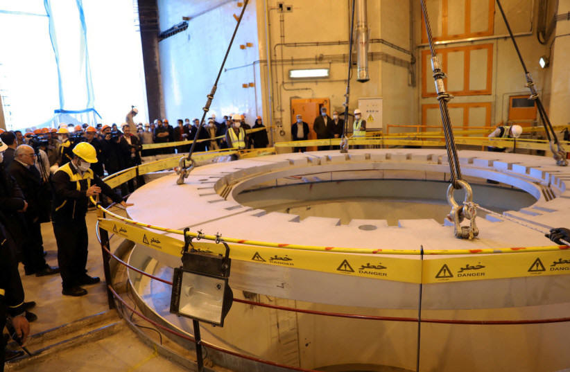 FILE PHOTO: Members of the media and officials tour the water nuclear reactor at Arak, Iran December 23, 2019. WANA (West Asia News Agency) via REUTERS  (photo credit: REUTERS)