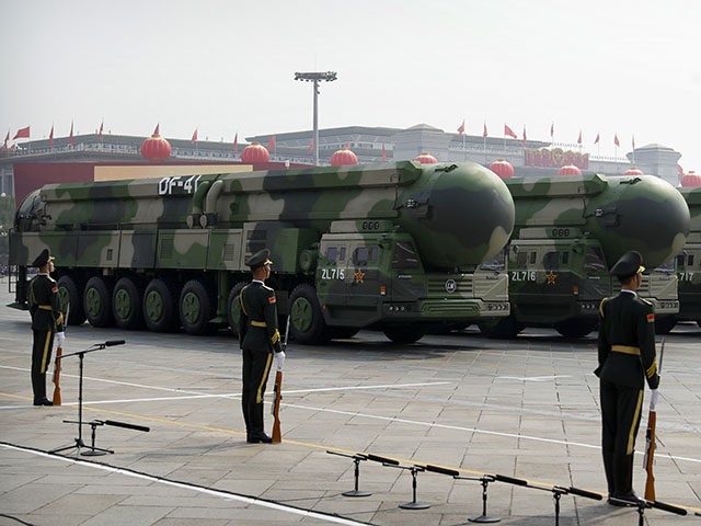 Chinese military vehicles carrying DF-41 ballistic missiles roll during a parade to commemorate the 70th anniversary of the founding of Communist China in Beijing, Tuesday, Oct. 1, 2019. Trucks carrying weapons including a nuclear-armed missile designed to evade U.S. defenses rumbled through Beijing as the Communist Party celebrated its 70th K