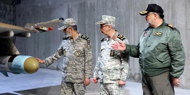 Iran's Army chief, Major General Abdolrahim Mousavi, and Iranian Armed Forces Chief of Staff Major General Mohammad Bagheri visit the first underground air force base, called "Eagle 44," at an undisclosed location in Iran. 