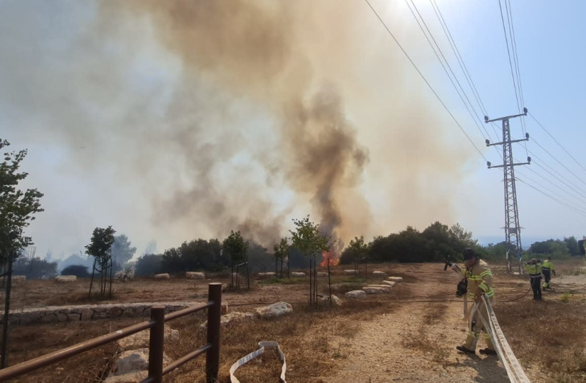 Fires burn close to the Gaza border after incendiary balloons were launched from inside the strip, August 6, 2021 (credit: FIRE AND RESCUE SERVICE SOUTHERN DISTRICT)