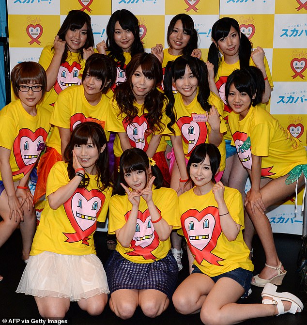 Many girls and women fall victim to the cruel, and often inescapable traps, as they are desperate for a job and money. Pictured: Nine adult Japanese porn actresses in Tokyo on August 30, 2014, as they were preparing to have their breasts squeezed by fans for 24 hours for a charity event loosely translated as 'Boob Aid'