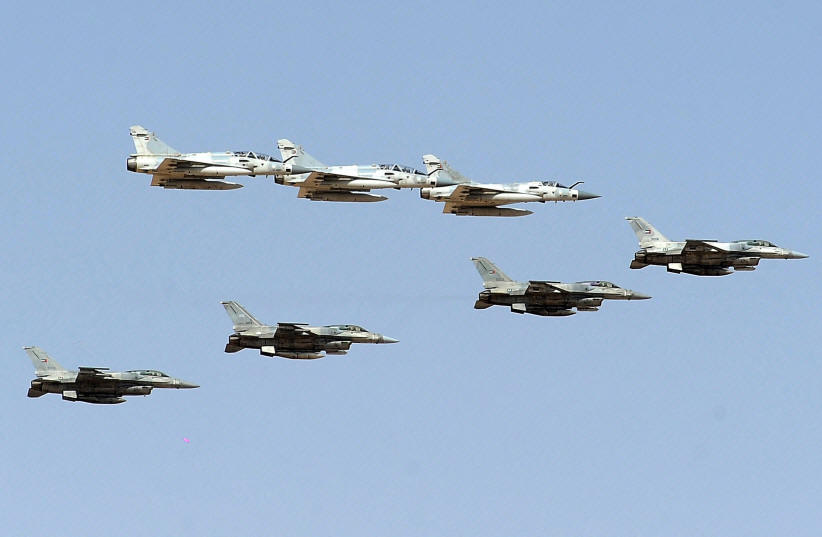 French-made Mirage 2000 and US-made F-16 fighter jets of the United Arab Emirates forces take part in joint military maneuvers with the French army in the desert of Abu Dhabi, May 2, 2012. (photo credit: REUTERS/BEN JOB)