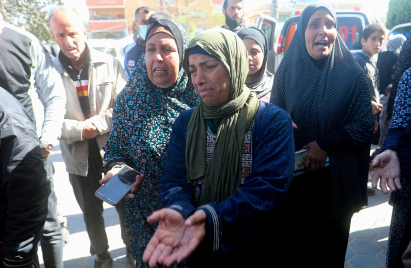  Women mourn Palestinians killed in Israeli strikes, amid the ongoing conflict between Israel and Hamas, at Al-Aqsa hospital in Deir Al-Balah in the central Gaza Strip, March 21, 2024.  (credit: REUTERS/Ramadan Abed)