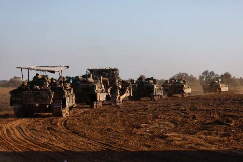 A convoy of Israeli military rolls into Israel from Gaza, amid the ongoing conflict between Israel and the Palestinian Islamist group Hamas, January 5, 2024. 